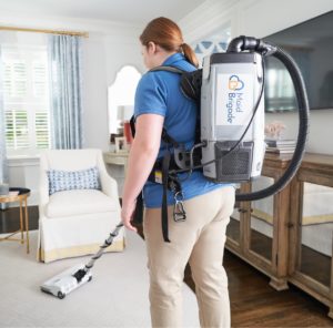 Maid cleaning carpet